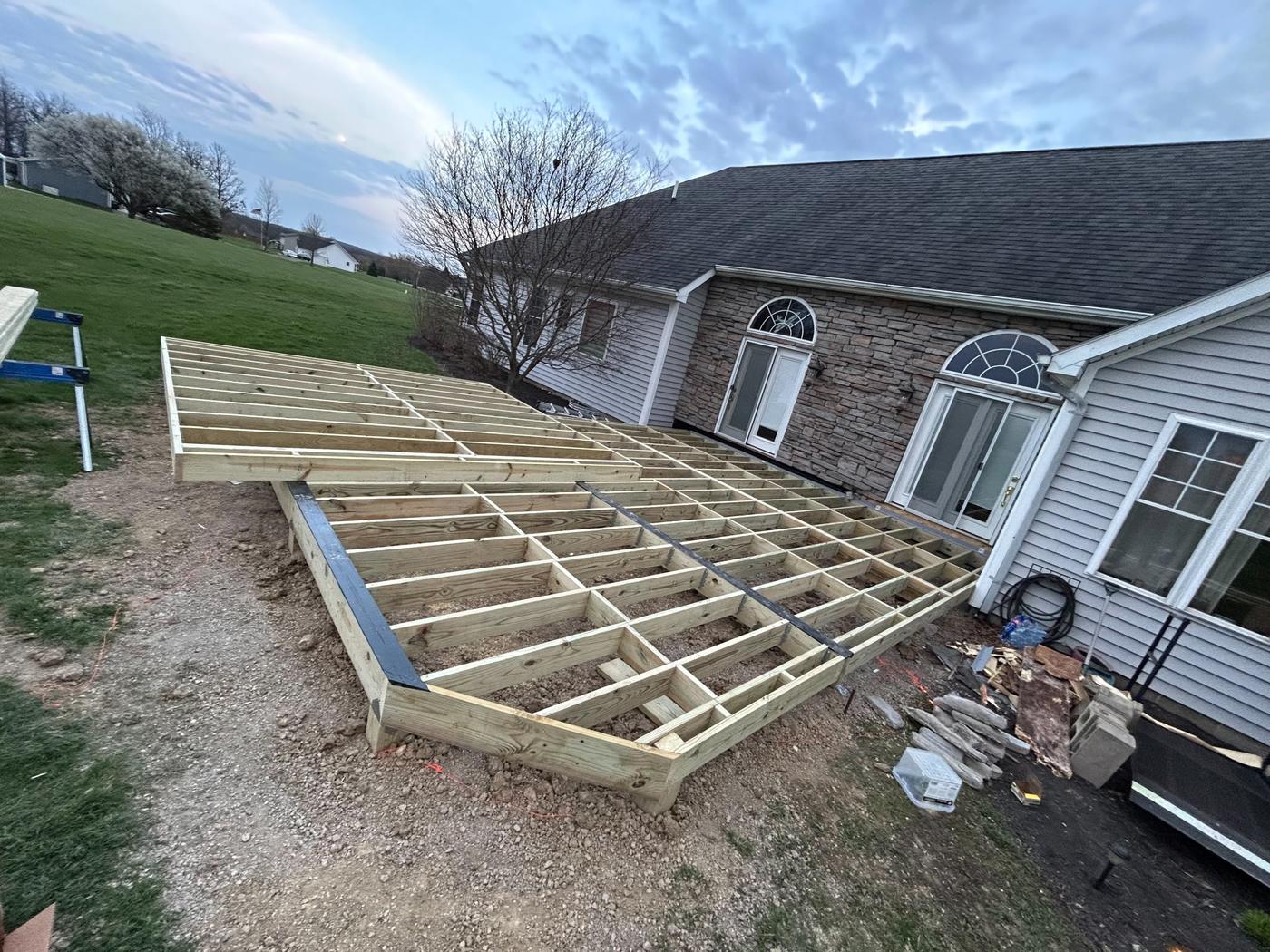 Large deck frame built off the back of a house