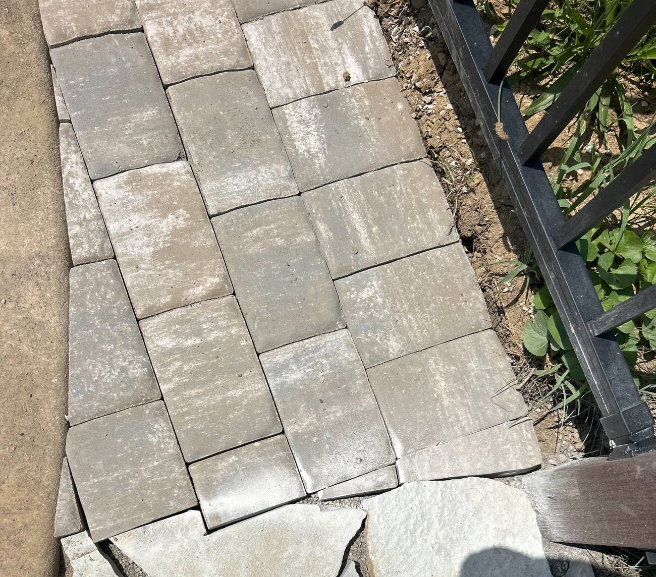 Paver walkway meeting a flagstone patio