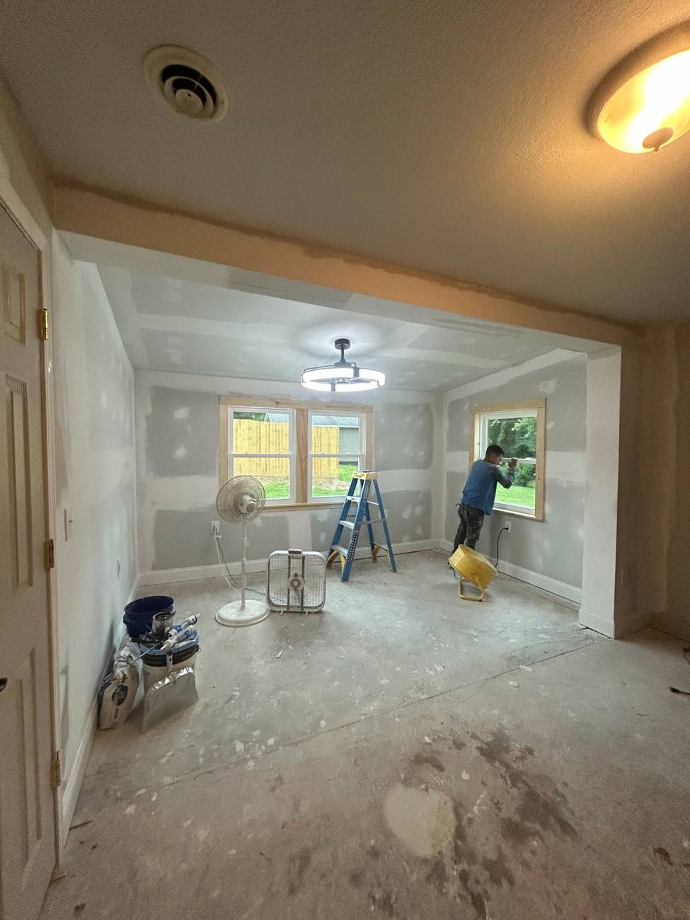 Room addition with new drywall and windows